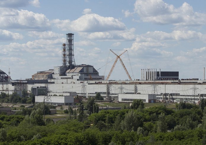 Chernobyl_NPP_Site_Panorama_with_NSC_Construction_-_June_2013