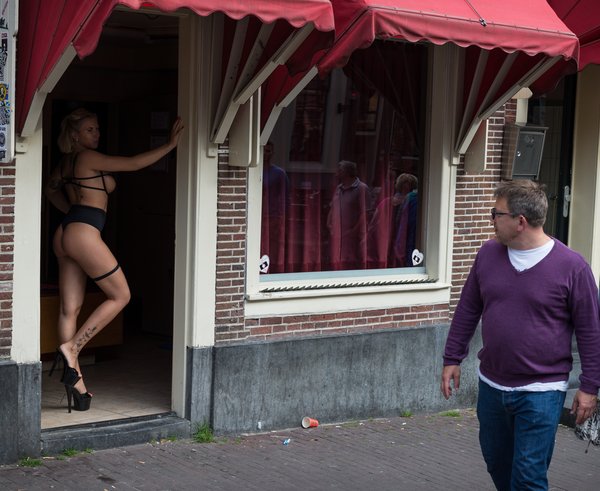 Prostitute_in_doorway,_Amsterdam