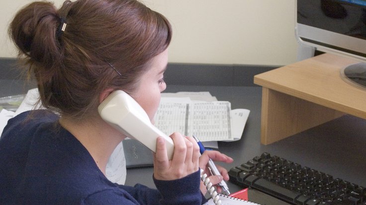 Woman_On_Telephone_In_Office