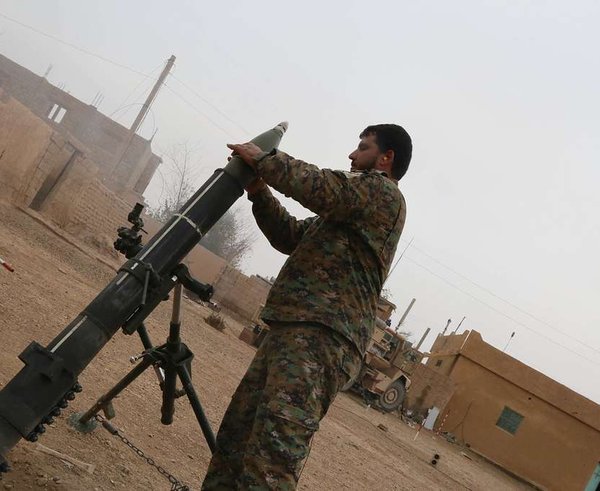 a-syrian-democratic-forces-sdf-member-readies-a-120mm-a8c429-1024