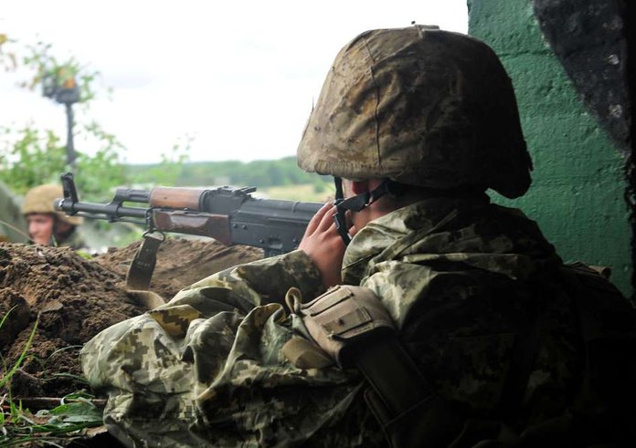 a-ukrainian-soldier-stands-guard-in-a-bunker-as-part-f2a17d-1024