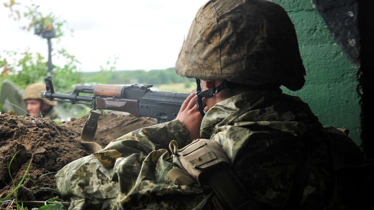 a-ukrainian-soldier-stands-guard-in-a-bunker-as-part-f2a17d-1024