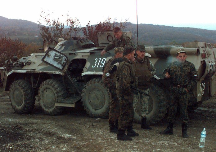 armed-russian-army-soldiers-stnad-on-and-next-to-their-ifor-marked-btr-80-armored-cd5663-1024