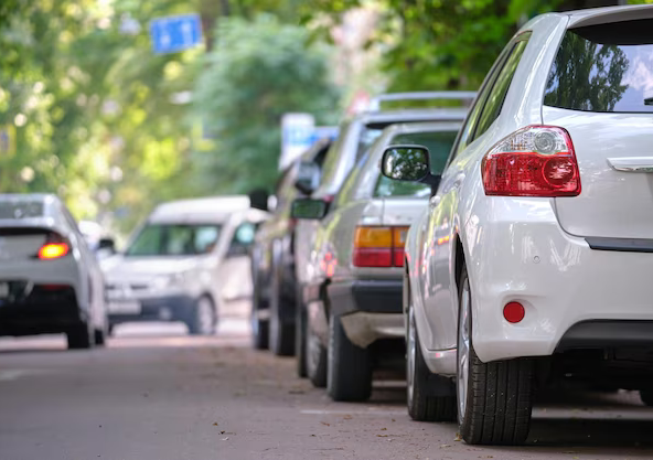 city-traffic-with-cars-parked-line-street-side_127089-18202