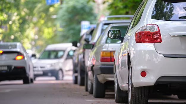 city-traffic-with-cars-parked-line-street-side_127089-18202