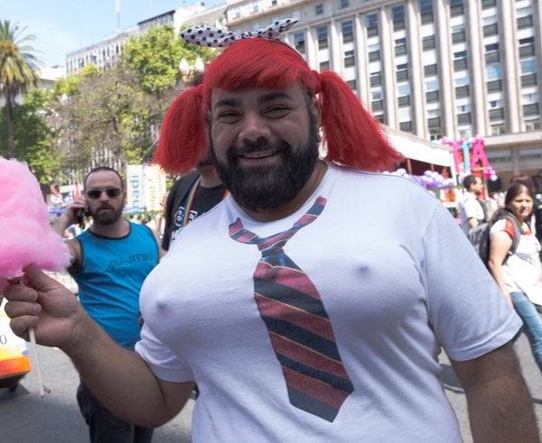 Young_homosexual_people_with_rainbow-colored_umbrella_at_Pride_parade_(51262327931)