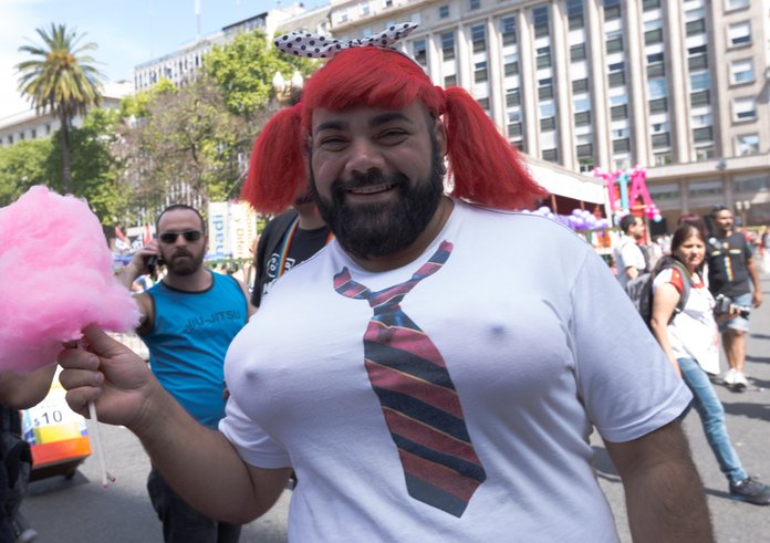 Young_homosexual_people_with_rainbow-colored_umbrella_at_Pride_parade_(51262327931)