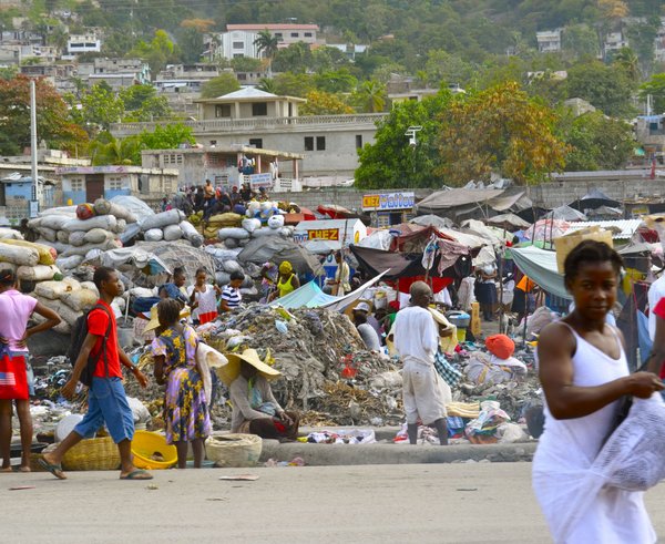 helping_people_volunteer_poverty_relief_haiti_third_world_trash-540226