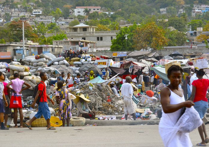 helping_people_volunteer_poverty_relief_haiti_third_world_trash-540226