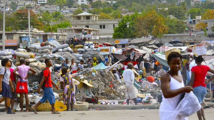 helping_people_volunteer_poverty_relief_haiti_third_world_trash-540226